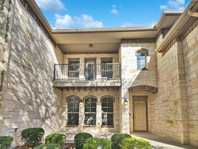 property entrance with a balcony