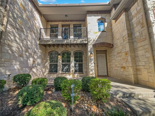 doorway to property featuring a balcony