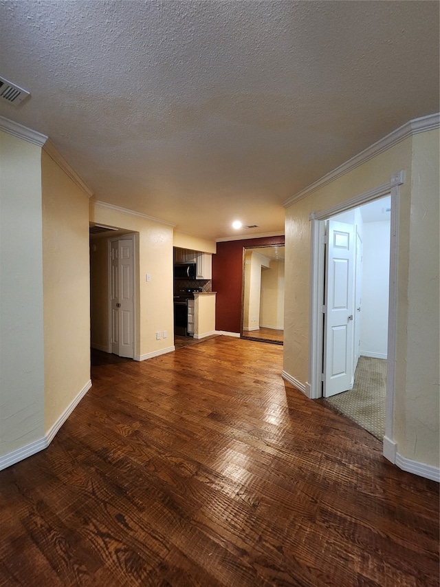 unfurnished living room featuring crown molding, dark hardwood / wood-style flooring, and a textured ceiling