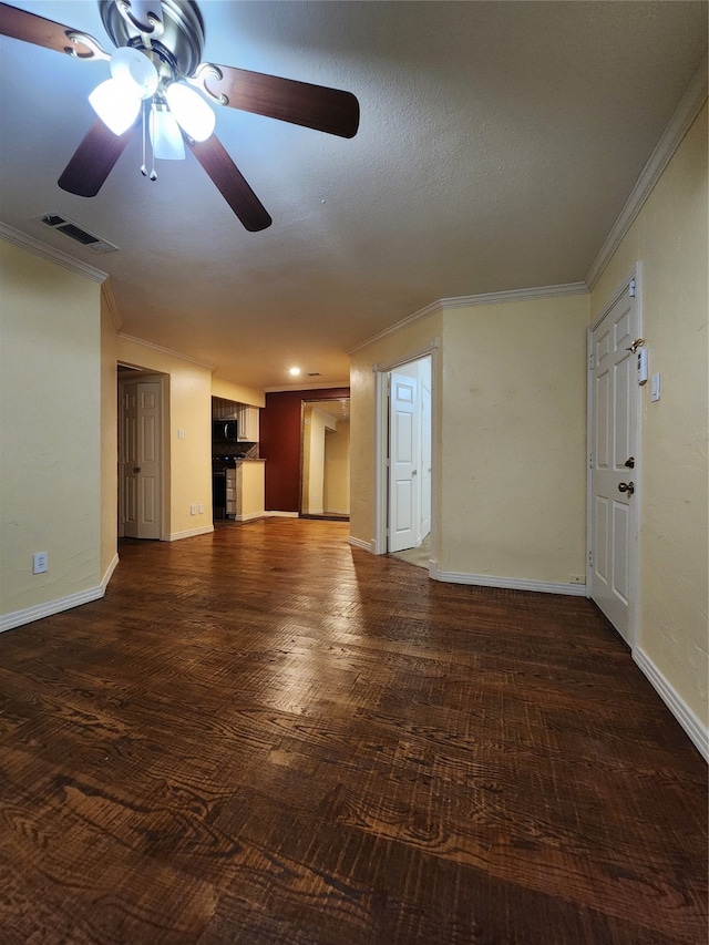 unfurnished living room with a textured ceiling, ceiling fan, crown molding, and dark wood-type flooring