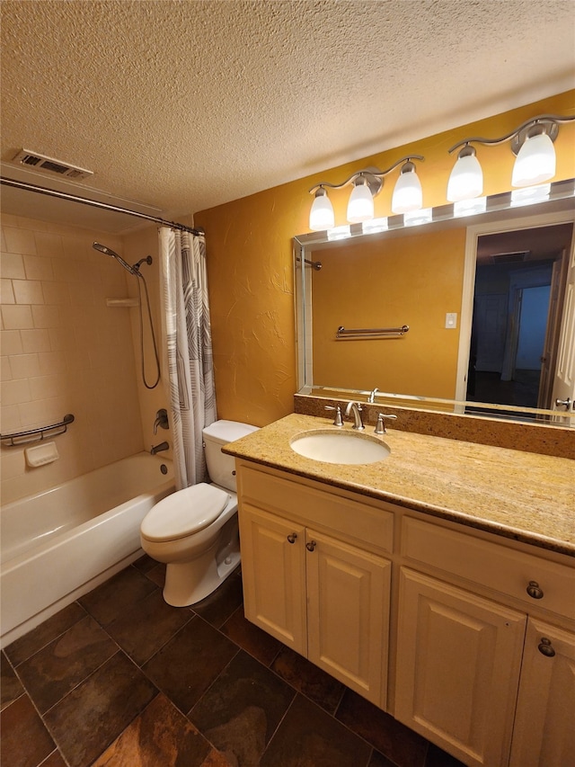 full bathroom featuring shower / tub combo with curtain, vanity, a textured ceiling, and toilet