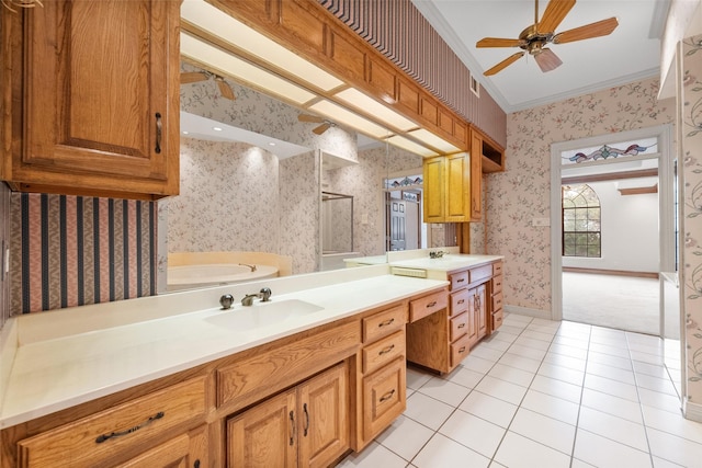 bathroom featuring tile patterned flooring, vanity, a bathtub, ornamental molding, and ceiling fan