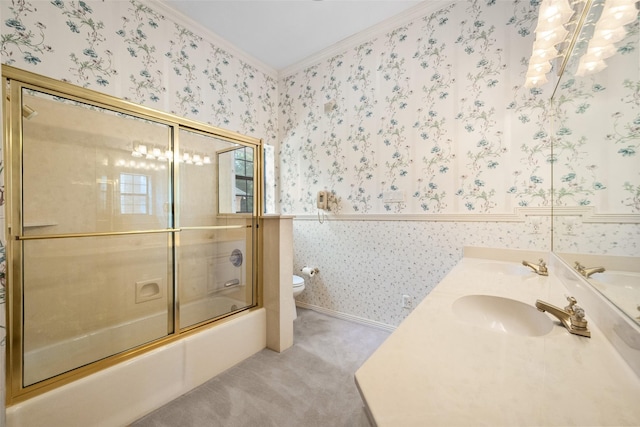 full bathroom with toilet, combined bath / shower with glass door, crown molding, and vanity