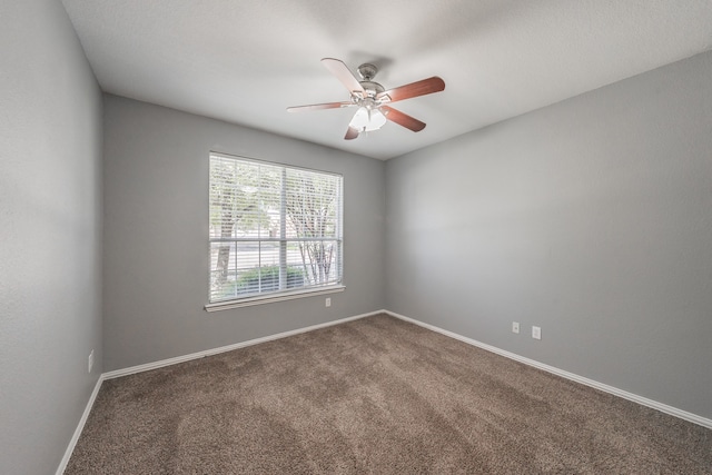 empty room with carpet and ceiling fan