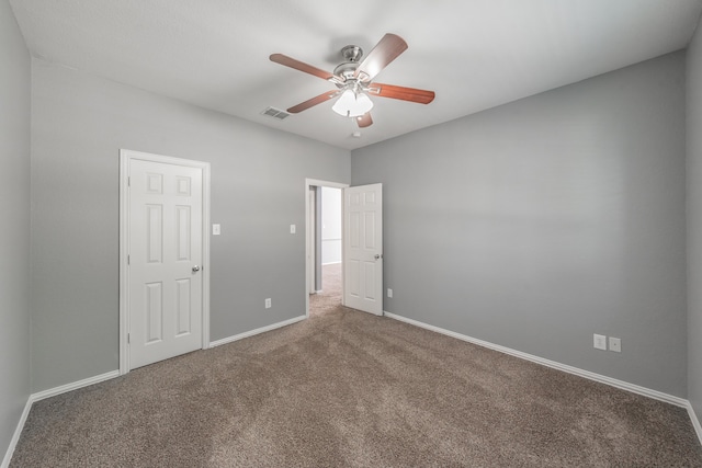 carpeted empty room with ceiling fan