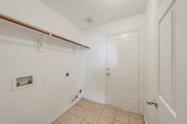 laundry room with hookup for an electric dryer, hookup for a washing machine, and light tile patterned floors