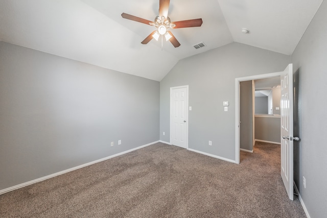 unfurnished bedroom featuring ceiling fan, carpet flooring, and lofted ceiling