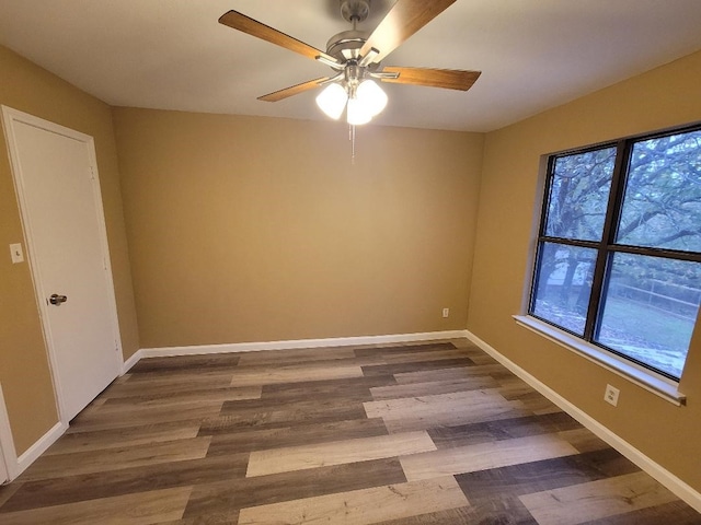 unfurnished room with wood-type flooring and ceiling fan