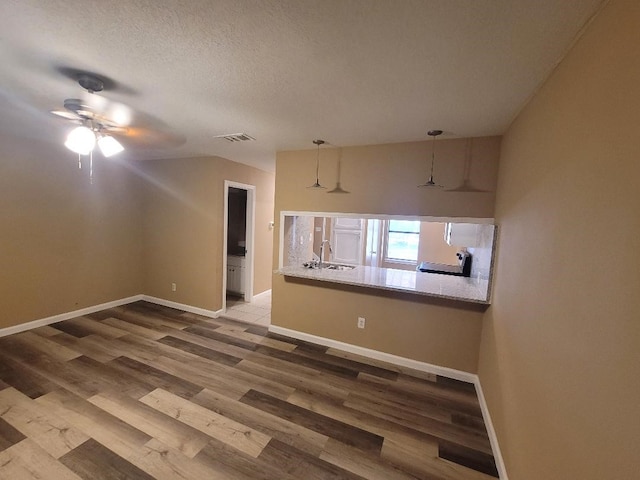 kitchen featuring stainless steel electric stove, dishwasher, white cabinets, and light tile patterned floors