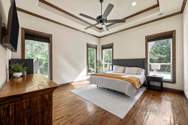 bedroom with light hardwood / wood-style flooring, multiple windows, and ceiling fan