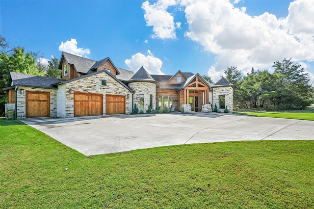 view of front of house with a front lawn and a garage