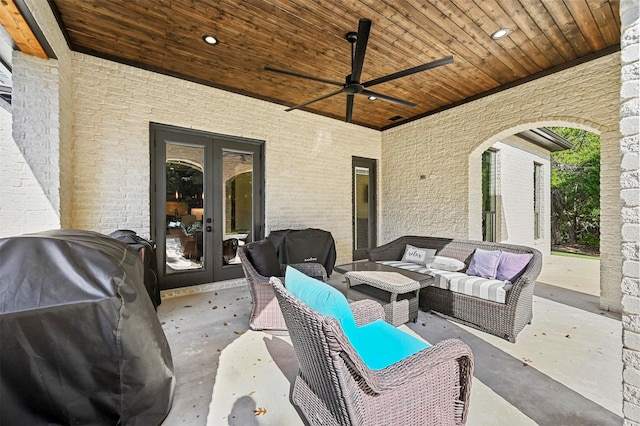 view of patio / terrace featuring french doors, an outdoor living space, grilling area, and ceiling fan