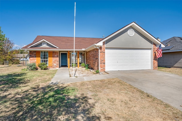 ranch-style home featuring a garage and a front lawn