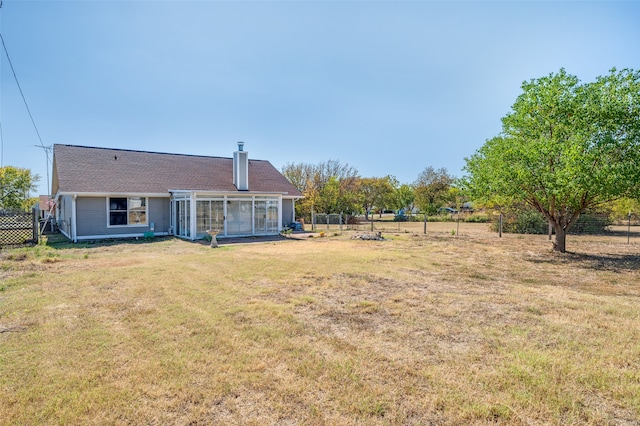 view of yard with a sunroom