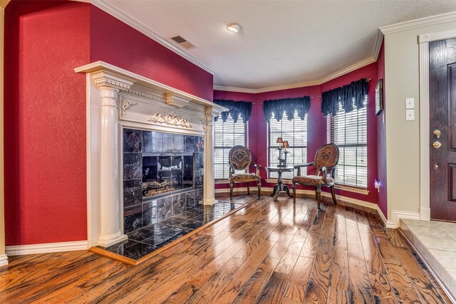 kitchen featuring a notable chandelier, wall chimney exhaust hood, backsplash, and stainless steel gas range