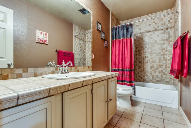 bathroom with tile patterned flooring, vanity, and ornamental molding