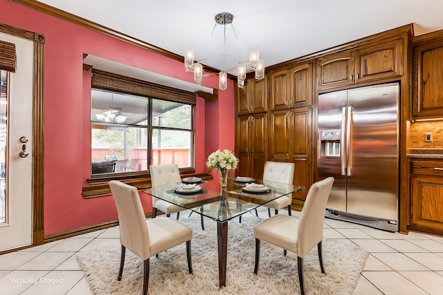 living area featuring hardwood / wood-style floors, ornamental molding, and a tile fireplace