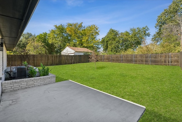 view of yard featuring a patio area and central AC