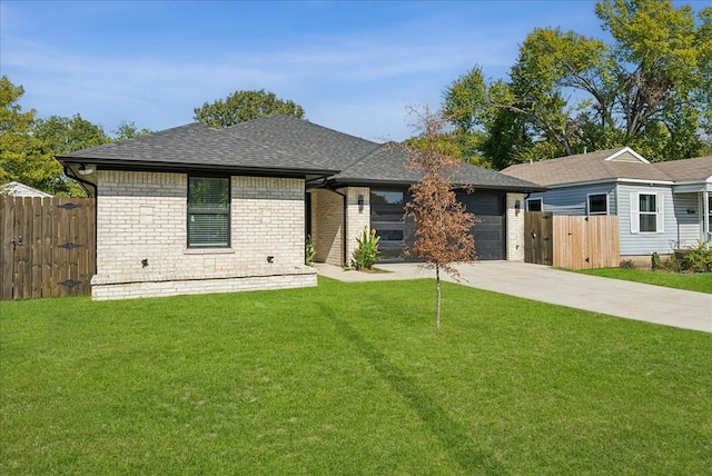 view of front facade featuring a garage and a front lawn