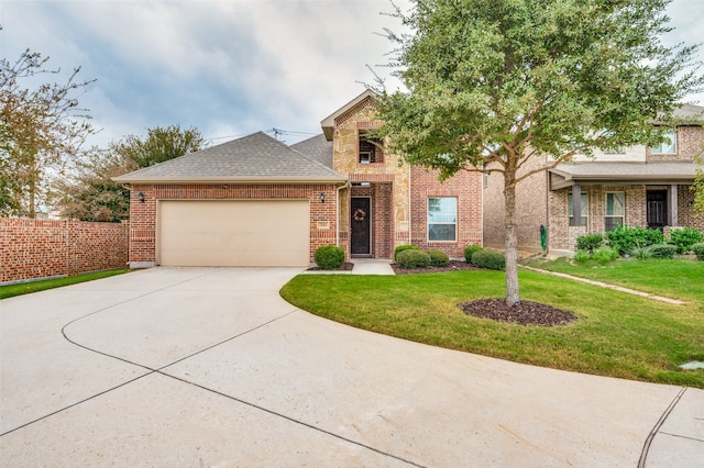 view of front of property with a front yard and a garage