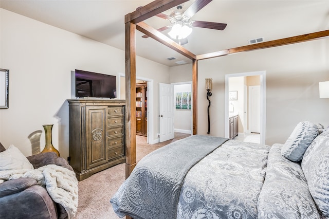 carpeted bedroom featuring connected bathroom and ceiling fan