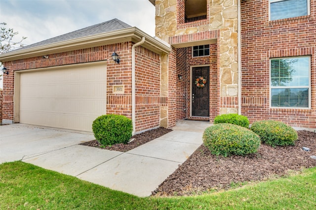 doorway to property featuring a garage