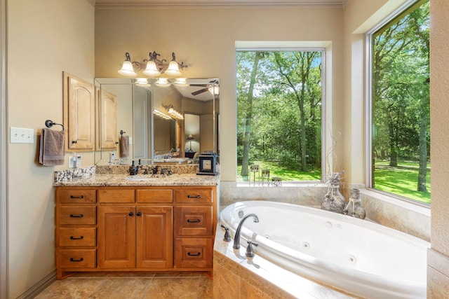 bathroom with vanity, tiled bath, ornamental molding, and ceiling fan