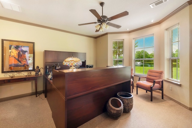 office space featuring light carpet, ornamental molding, and ceiling fan