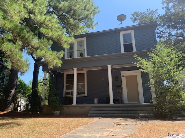 view of front of home featuring a porch and cooling unit