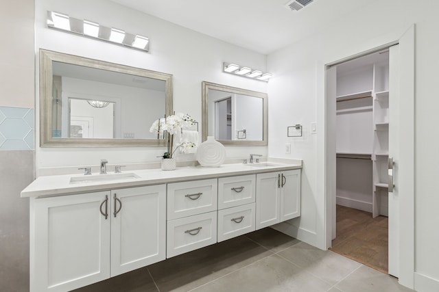 bathroom featuring vanity and tile patterned flooring