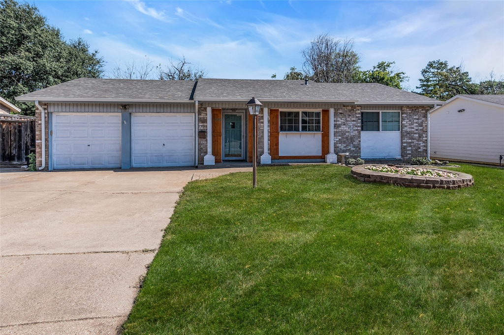 single story home with a front lawn and a garage