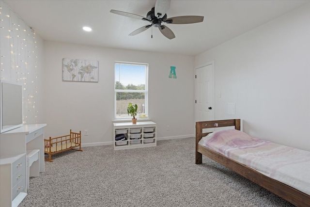 carpeted bedroom featuring ceiling fan