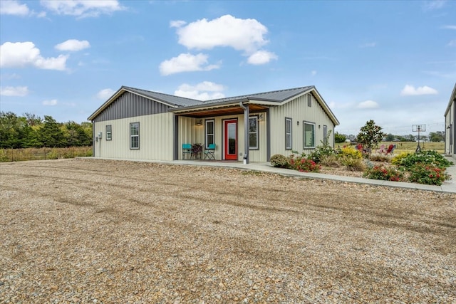 view of front of house with metal roof and covered porch