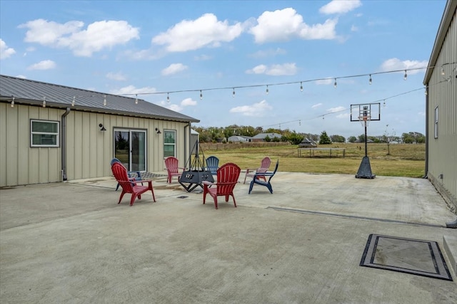 view of patio with a fire pit