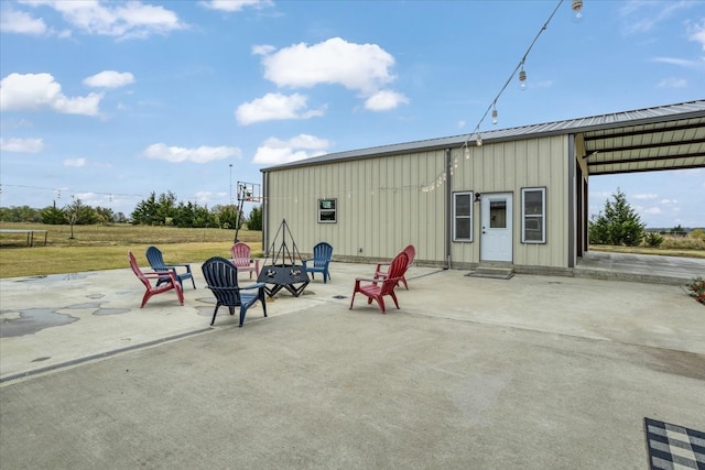 exterior space featuring an outdoor fire pit