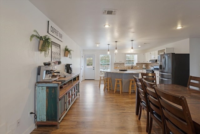 dining area with light hardwood / wood-style floors