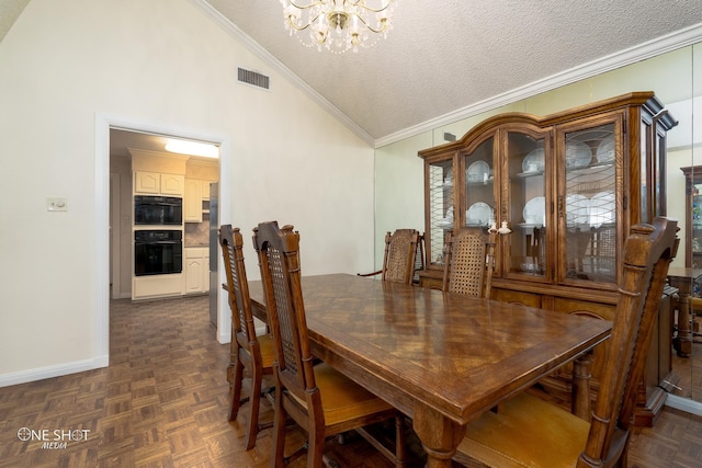 dining space featuring crown molding, dark parquet flooring, a chandelier, and a textured ceiling