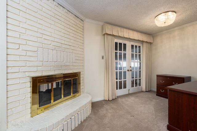 interior space with light carpet, a textured ceiling, ornamental molding, a fireplace, and french doors