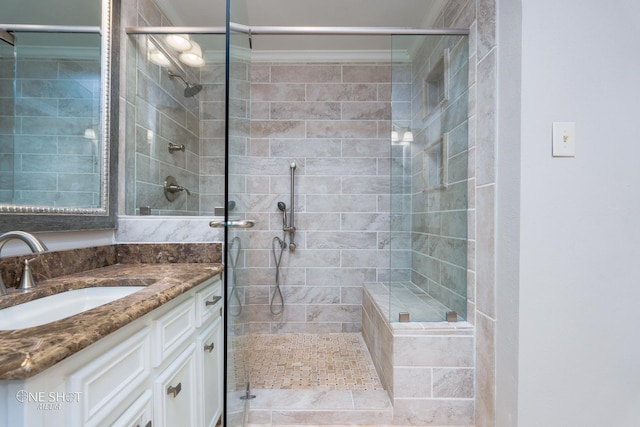 bathroom featuring vanity and walk in shower