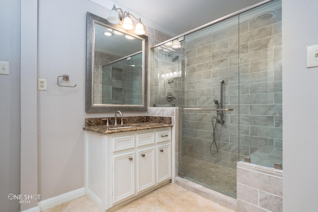 bathroom featuring vanity, an enclosed shower, and tile patterned floors