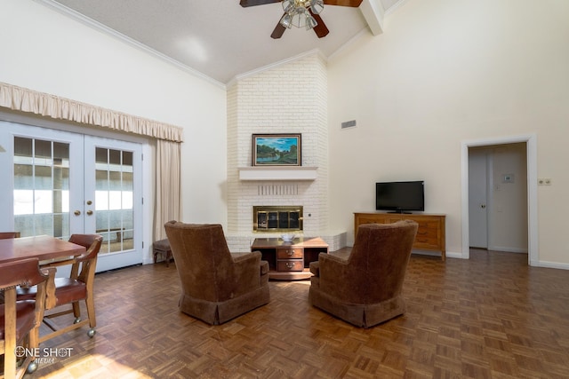 living room featuring ceiling fan, high vaulted ceiling, a brick fireplace, dark parquet flooring, and french doors