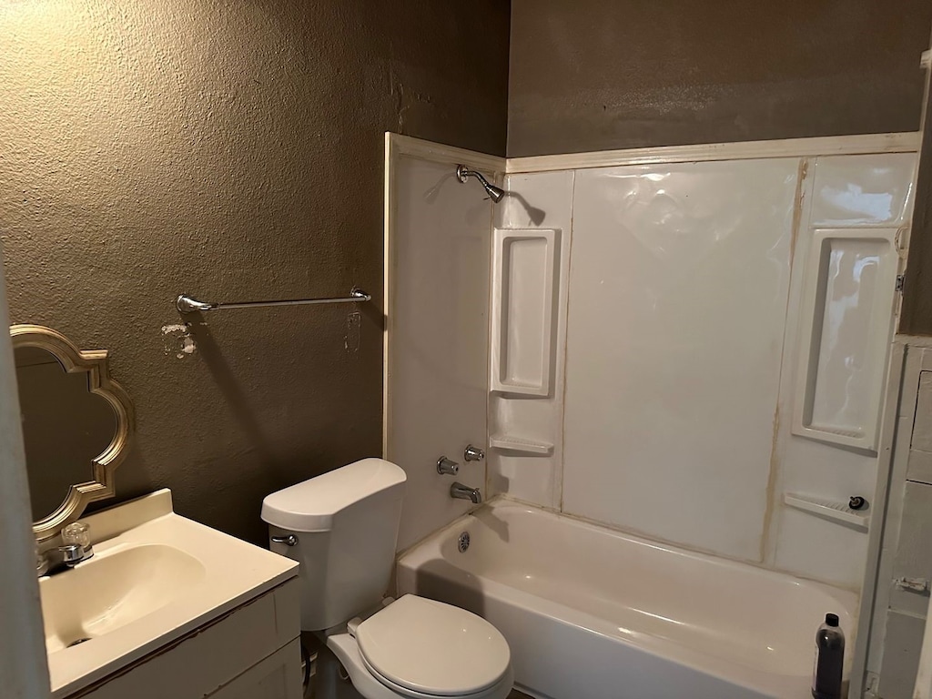 full bathroom featuring vanity, toilet, and shower / bathtub combination