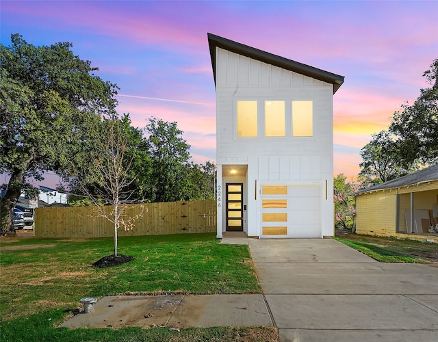 contemporary home with a lawn