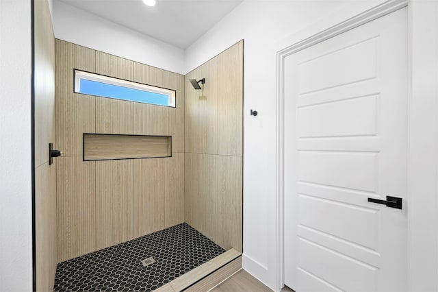 bathroom with a tile shower