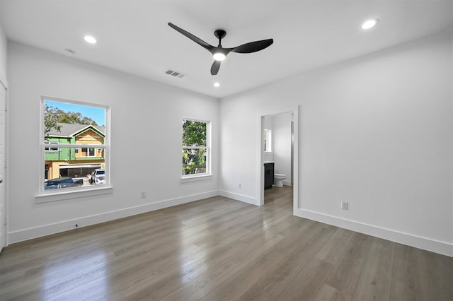 unfurnished room featuring light wood-type flooring and ceiling fan