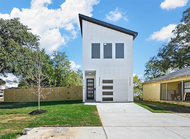 contemporary home featuring a front lawn