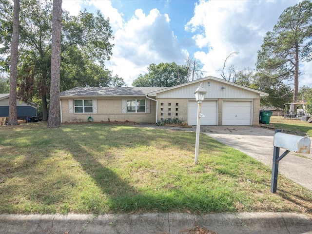 single story home featuring a front lawn and a garage