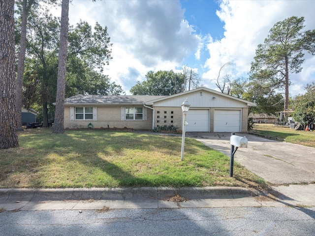 single story home with a garage and a front yard