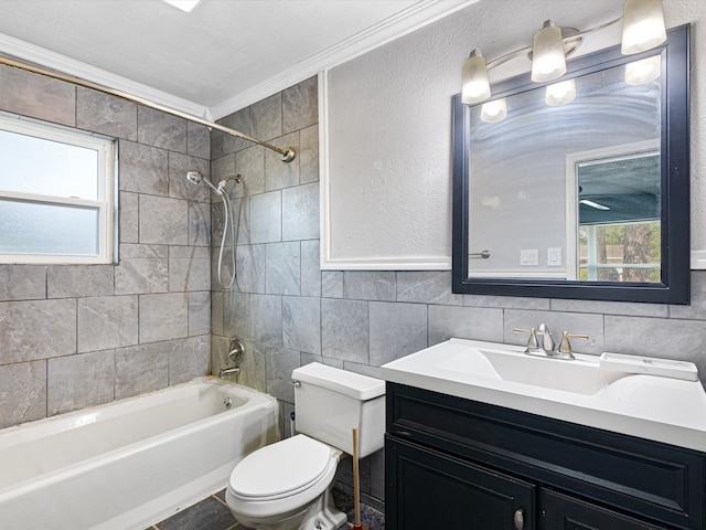 full bathroom with plenty of natural light, ornamental molding, toilet, and tiled shower / bath