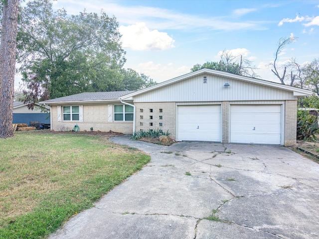 ranch-style home with a garage and a front yard